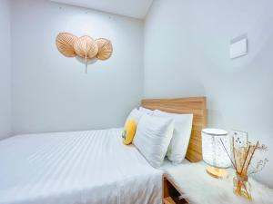 Giường trong phòng chung tại HomeAway - Melody Apartment Vũng Tàu