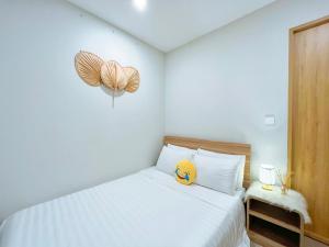 Giường trong phòng chung tại HomeAway - Melody Apartment Vũng Tàu