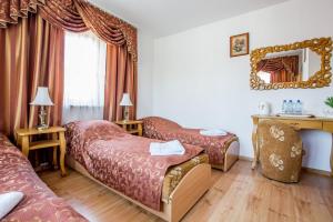 Postel nebo postele na pokoji v ubytování Pod Modrzewiami