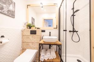 a bathroom with a sink and a shower at Pokoje Janosik in Zakopane