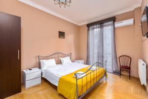 Postel nebo postele na pokoji v ubytování Sunny Hotel Tbilisi