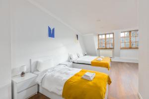Postel nebo postele na pokoji v ubytování Sunny Hotel Tbilisi