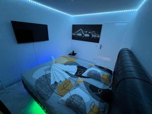 a bedroom with a bed with a glass table at Golden seconds in Strasbourg