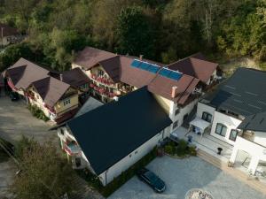 an overhead view of a house with solar panels on it at Pensiunea Marinela in Sighetu Marmaţiei