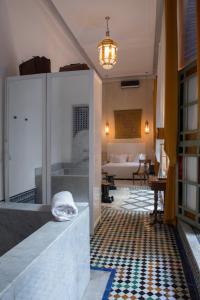 a hallway with a living room with a couch at Riad Palais Bahia Fes in Fez