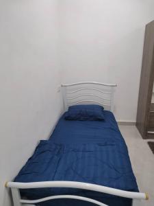 מיטה או מיטות בחדר ב-D'Parking Homestay Klia Sepang Budget Murah