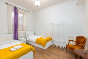 Postel nebo postele na pokoji v ubytování Sunny Hotel Tbilisi