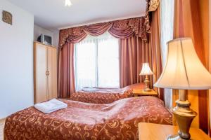 Postel nebo postele na pokoji v ubytování Pod Modrzewiami