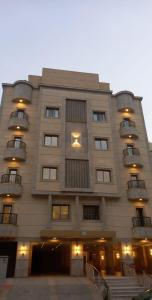 a large building with balconies on the side of it at Ammash Services and Hotel Rooms in Jeddah