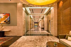 a hallway of a hotel with a long corridor at Manila Marriott Hotel in Manila