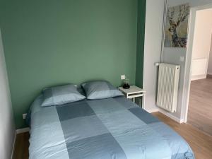Katil atau katil-katil dalam bilik di GDK locations meublés DUNKERQUE