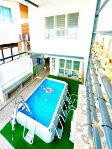 a swimming pool on the balcony of a house at Getaway Villa Bangkok - 4 Bedroom,6 Beds and 5 Bathroom in Bangkok