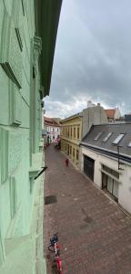 a view of a city street from a building at Apartmány Zvonárska in Košice