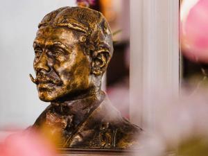 a bronze bust of a man with a cigarette at Le Grand Hotel de Cabourg - MGallery Collection in Cabourg