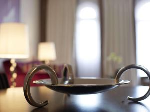 a metal tray on top of a table at Le Grand Hotel de Cabourg - MGallery Collection in Cabourg