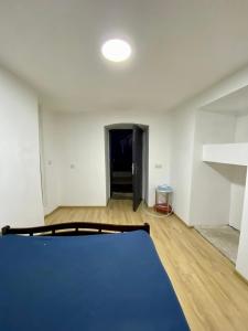 an empty room with a blue mat on the floor at дом в старом тбилиси in Tbilisi City