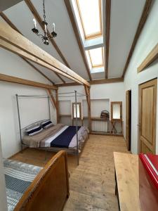 a bedroom with a bed and a skylight at Rustic room 2 next to beach in Constanţa