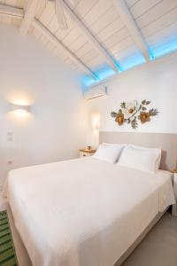 מיטה או מיטות בחדר ב-Valandou Guesthouses