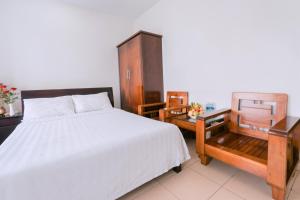 Llit o llits en una habitació de Lotus Rock Hotel Đà Nẵng