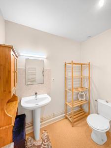 a bathroom with a sink and a toilet at SeaHaven in Saint-Brieuc