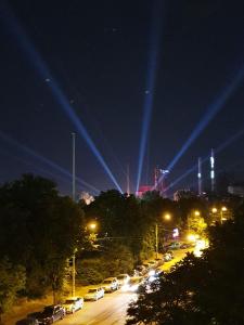 a parking lot filled with cars at night with lights at Apartmány Gajdošova in Moravská Ostrava