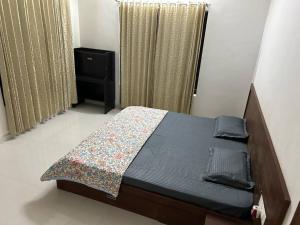 Giường trong phòng chung tại Al Falah Homestay Kasaragod