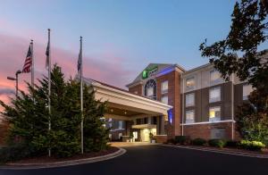 a rendering of the front of a hotel at Holiday Inn Express Hotel & Suites Greensboro - Airport Area, an IHG Hotel in Greensboro