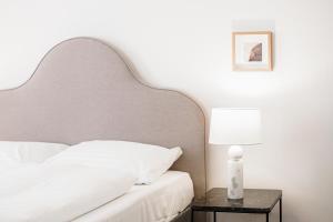 Postel nebo postele na pokoji v ubytování HeyMi Apartments Zentagasse