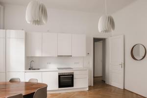 Kuchyň nebo kuchyňský kout v ubytování HeyMi Apartments Zentagasse