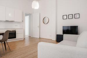 Kuchyň nebo kuchyňský kout v ubytování HeyMi Apartments Zentagasse
