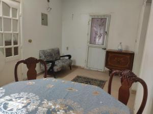 a dining room with a table and a chair at Elkhaima motel in Giza