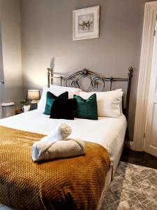 a bedroom with a bed with a towel on it at A&A Luxury Stay Eldon Street in Pallion
