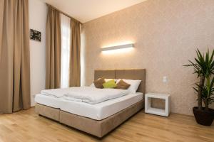 Łóżko lub łóżka w pokoju w obiekcie Vienna Stay Apartments Castellez 1020