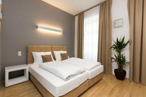 Łóżko lub łóżka w pokoju w obiekcie Vienna Stay Apartments Castellez 1020