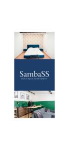 folleto de un dormitorio con cama y escritorio en SambaSS Boutique Apartment, en Capua