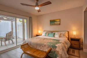 a bedroom with a bed and a ceiling fan at NEW Stylish & Cozy Dune Daisy near Beach & Flagler in New Smyrna Beach