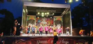 a group of people standing on a stage at Mobil Home 6 personnes camping 4 etoiles Bonne Anse la Palmyre in Les Mathes +29 photos