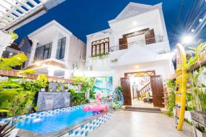 a house with a pool and a water park at Villa Hồ Bơi HOÀNG ĐỨC Trung Tâm BÃI SAU in Vung Tau