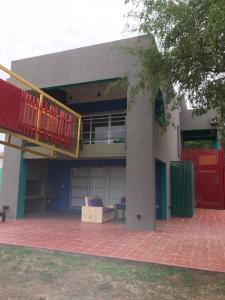 a house with a deck and a balcony on it at Apart Gallery - San Lorenzo - Salta in Salta