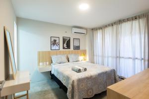 Ένα ή περισσότερα κρεβάτια σε δωμάτιο στο Cumbuco Wai Wai Apartamento com vista para o mar
