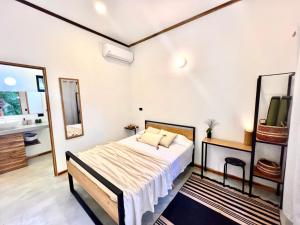Voodi või voodid majutusasutuse Calipso Ocean Lodge- Avellana Beach Hotel toas