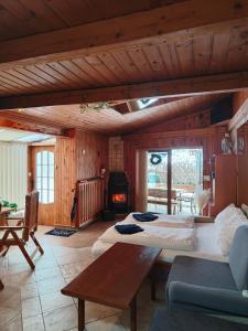 a large room with two beds and a fireplace at Kranio in Karlovy Vary