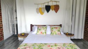 En eller flere senger på et rom på Cabañas “Pacha Mama”