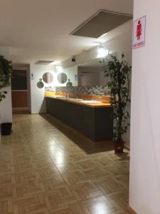 a large room with a counter in a building at Urban rest zone and coworking in Arrecife