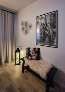 a living room with a bed and a picture on the wall at Arctic Circle Home in Rovaniemi