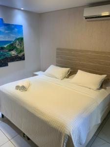 a bedroom with a large bed in a room at Marina Noronha Pousada in Fernando de Noronha