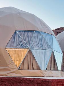 a dome tent with a window on top of it at Maraheb Luxury camp in Wadi Rum