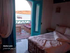 Postel nebo postele na pokoji v ubytování Miskaa Nubian House