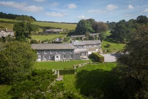 an aerial view of a large house in a field at Harlequin House in Holbeton