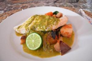 a plate of food with a piece of bread and vegetables at Korovou Eco Lodge in Naviti Island